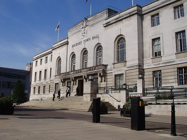 Hackney Town Hall and its square beneath a blue sky