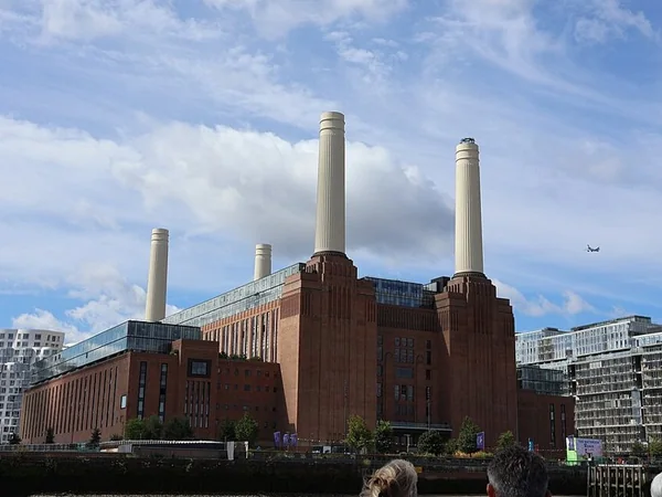 Battersea Power Station and its four chimneys seen from the Thames